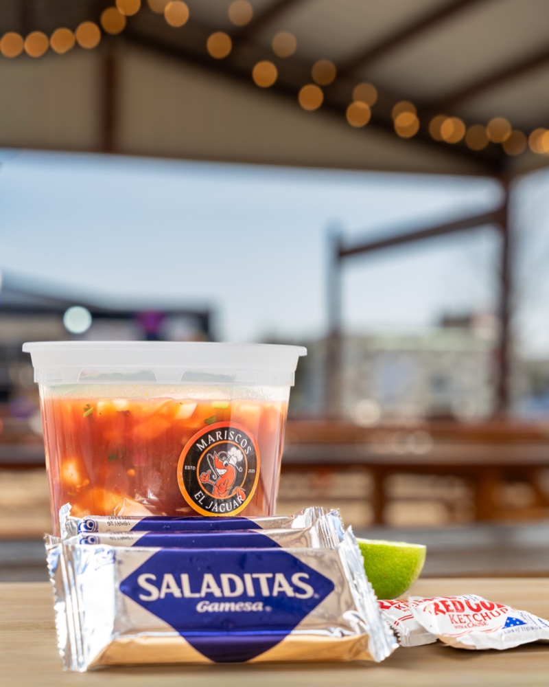 Mariscos El Jaguar branded ceviche cup with Saladitas crackers — Austin lifestyle food photography