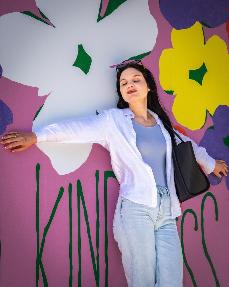 Lifestyle portrait at an Austin mural — natural light photography