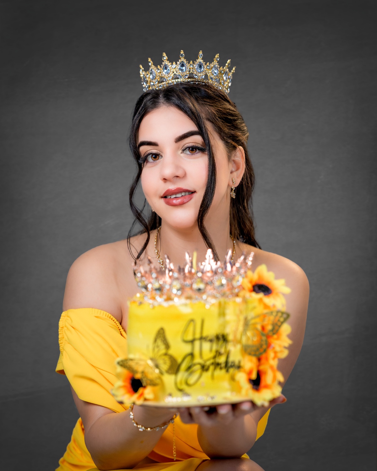 Editorial birthday portrait with crown and sunflower cake, yellow dress — Austin photographer