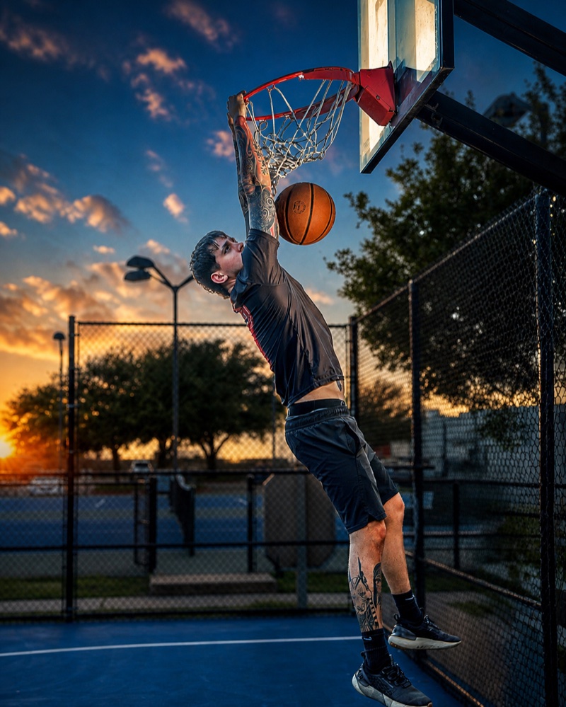 Editorial action portrait of basketball player dunking at sunset — Austin sports photographer